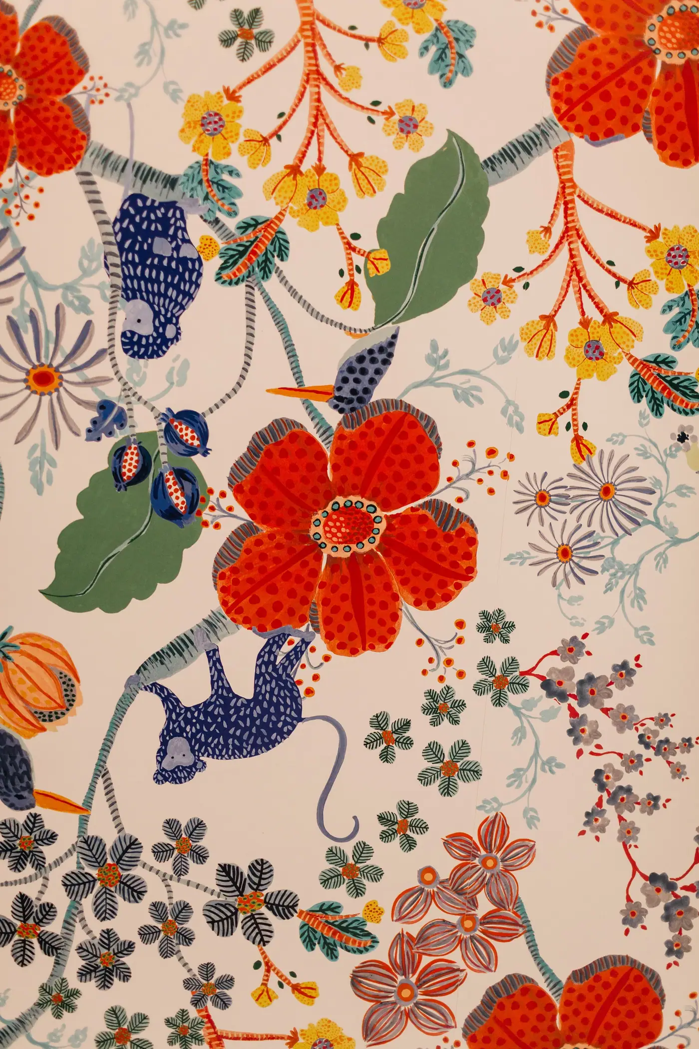 Ceiling wallpaper with red flowers, yellow blooms, green leaves, and blue monkeys in the Overton Park primary bath